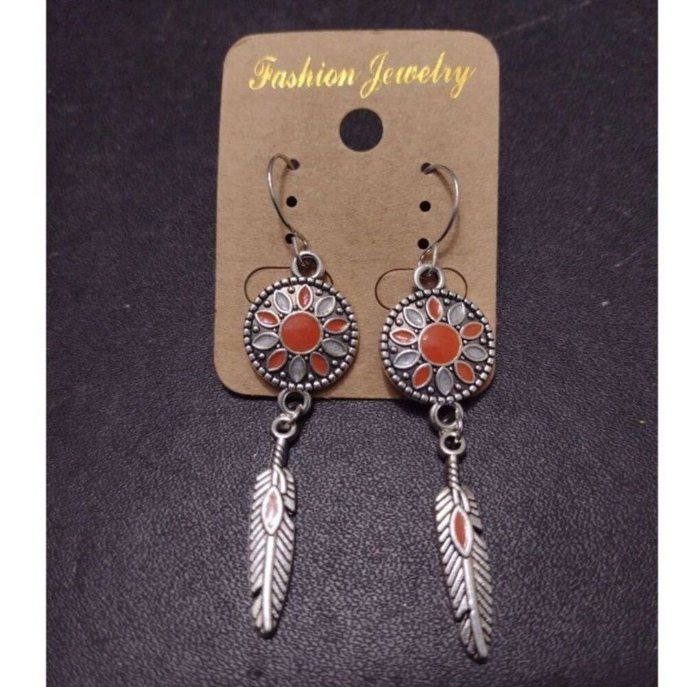 Silver tone southwestern themed feather earrings